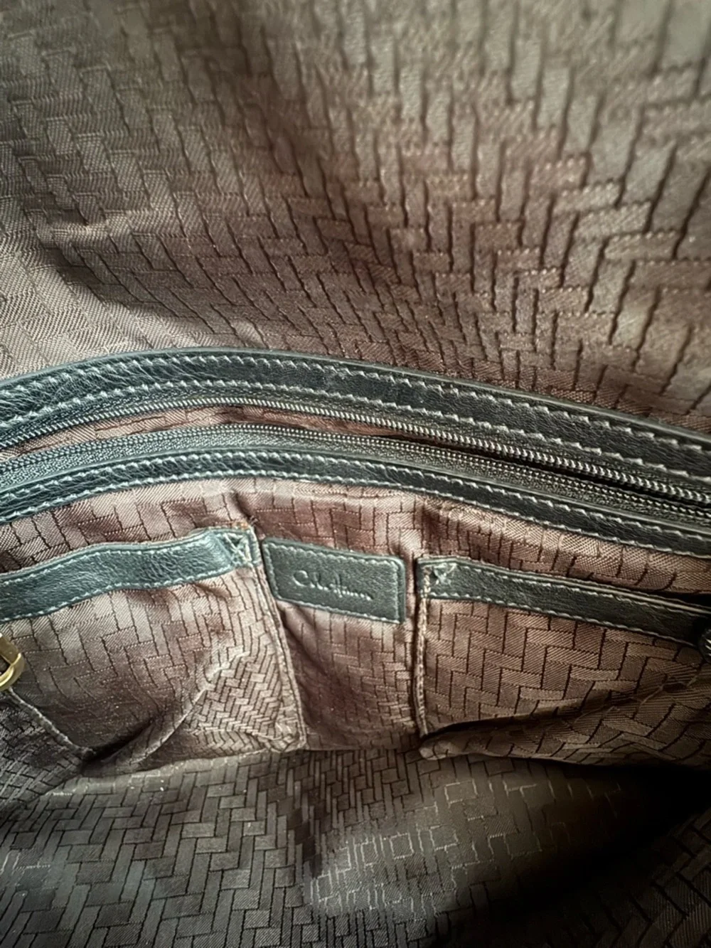 Cole Haan black leather messenger bag with gold hardware